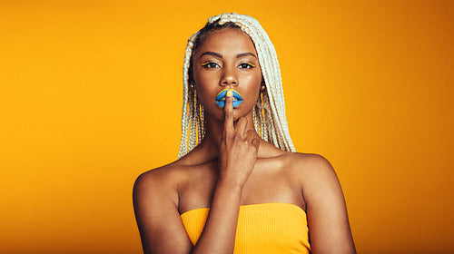 African american woman on yellow background