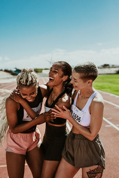 Female runners celebrating victory
