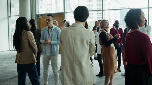 Business professionals networking at conference event