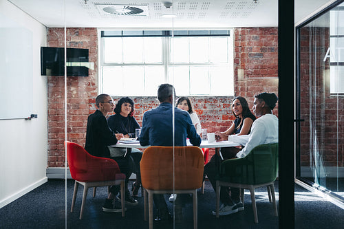 Businesspeople attending their morning briefing in an office