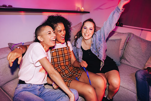 Group of girlfriends having fun at a house party