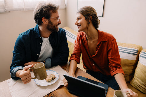 Couple shares coffee and conversation at home