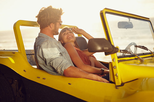 Romantic young couple in a car