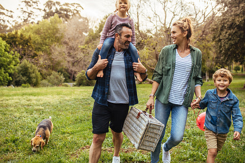 Family arriving in the park for picnic