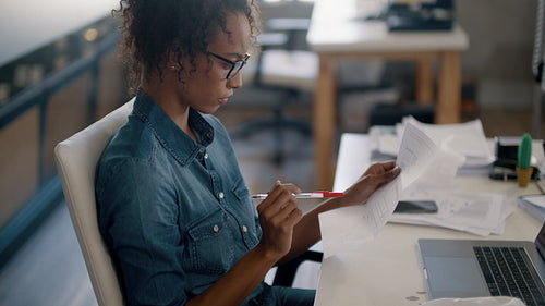 Businesswoman preparing a parcel for delivery