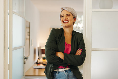 Cheerful businesswoman smiling in an office