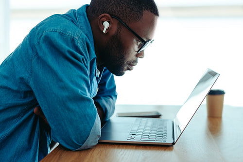 African man engaged in e-learning