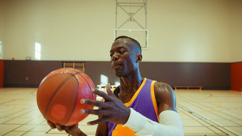 Smiling basketball player on indoor court