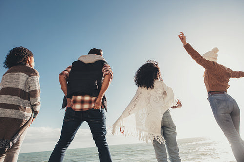 Friends standing outdoors on a sunny day