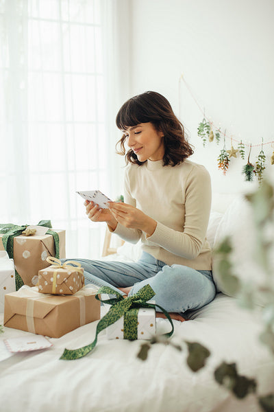 Woman checking out her christmas presents and letters