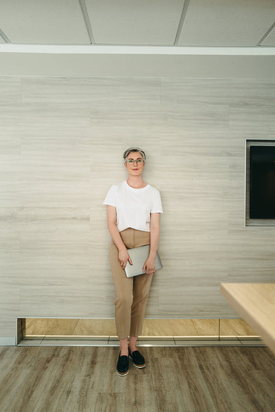 Mature female entrepreneur standing in a modern office