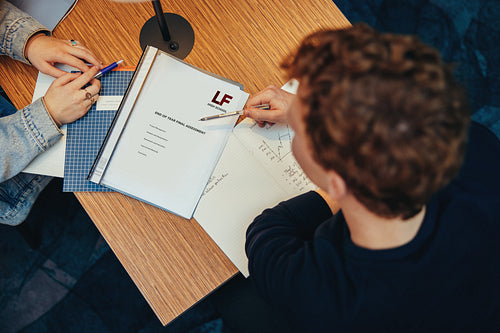 Students in library working on college project