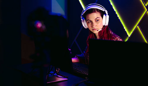 Woman live streaming a video game on an online platform