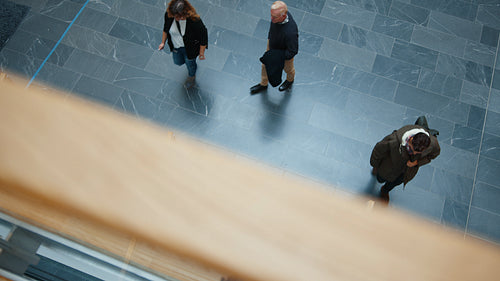 Co-working space: People walking up and down outside an office building
