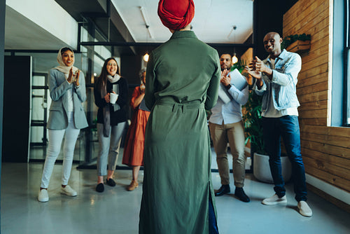 Team leader receiving an applause in a modern office