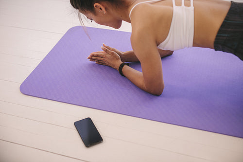 Young woman doing core exercise