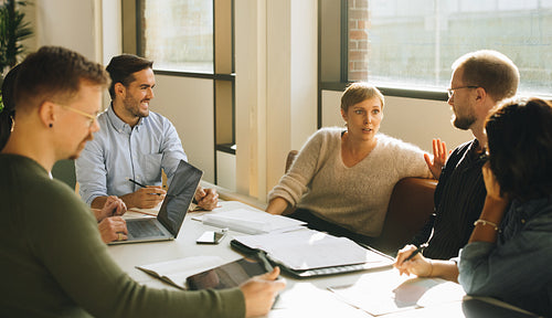 Brainstorming session in boardroom with creative team