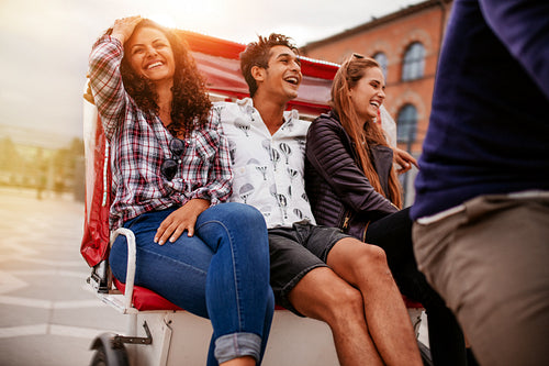 Best friends having fun on tricycle