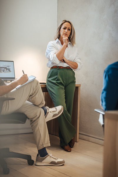 Professional woman engaged in discussion at architecture office
