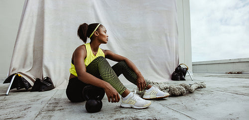 Fitness woman relaxing after workout session