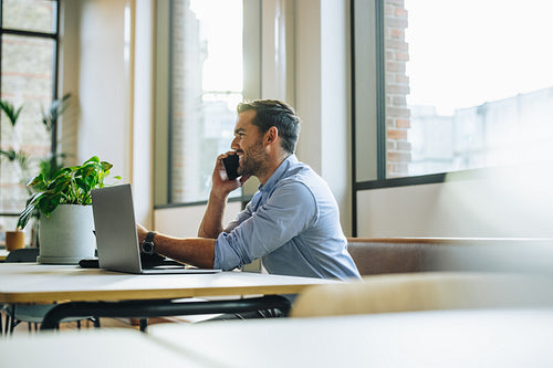 Executive talking on cell phone