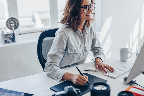 Female photographer retouching images