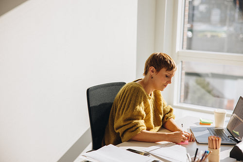 Woman working at her office desk