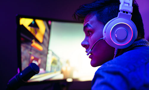 Video game player live streaming his game for a community of online players and streamers