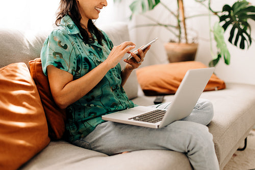 Young woman surfing the net at home