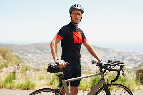 Male athlete taking a break after cycling training session