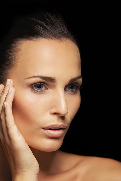 Beautiful young female model looking away