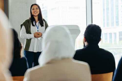 Woman leading a business presentation at a conference event