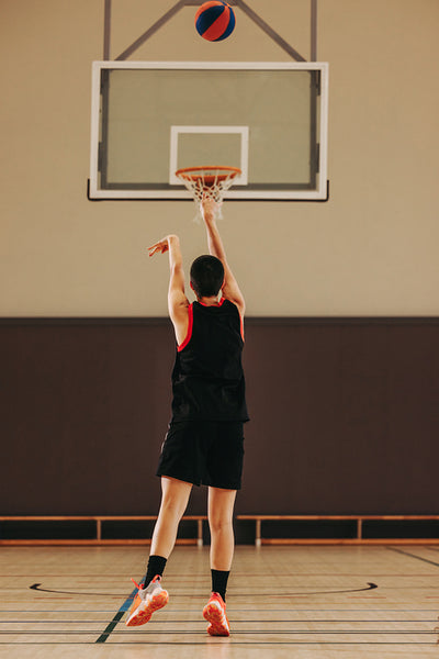 Perfect release: Female player sinks a three-pointer from the arc