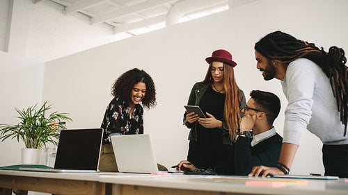 Business colleagues discussing work in office