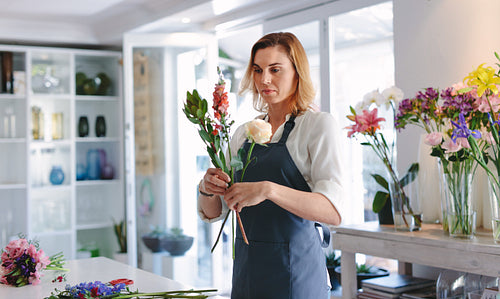 Woman making a bouquet with fresh flowers