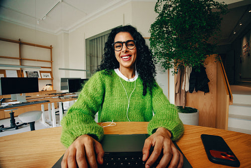 Professional business woman working with a laptop in a bright office workspace
