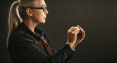 Goldsmith examining the ring