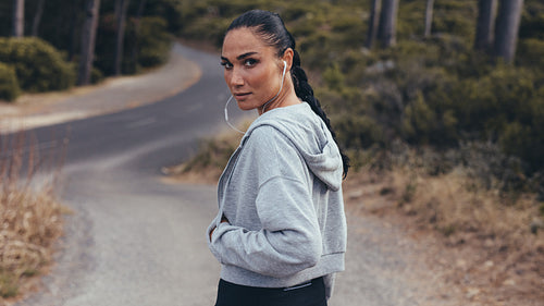 Sporty woman on cross country path