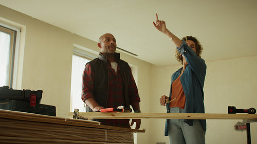 Creating something new: Middle-aged couple planning a home renovation