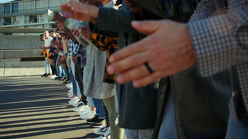 People clapping at a protest event