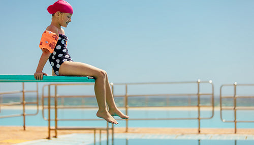 Girl on diving spring board