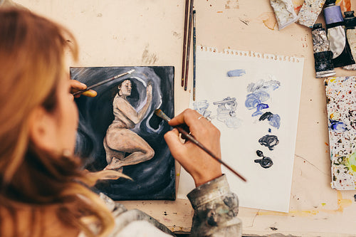 Female artist painting picture