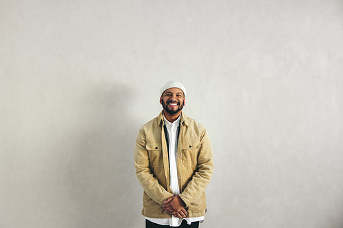 Businessman with a septum ring smiling at the camera