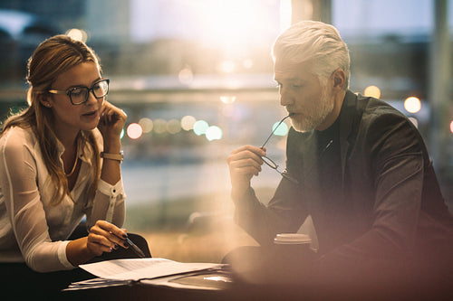 Business man and woman reviewing some documents