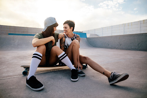 Friends enjoying spending time together at skate park