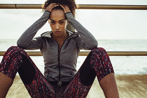 Urban runner looking tired after workout