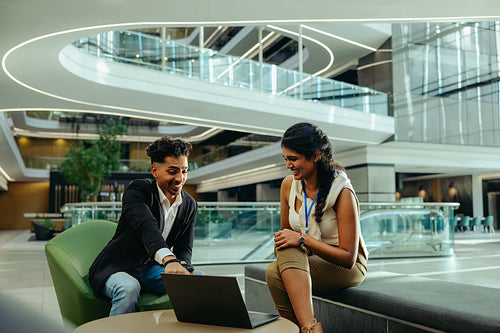 Young professionals engaging in a lively corporate meeting
