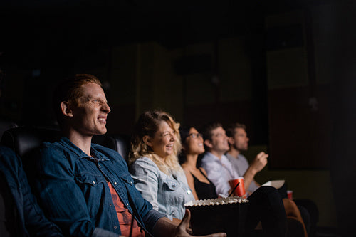 Group of people in multiplex movie theater