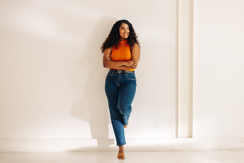 Young businesswoman looking away with a smile in an office