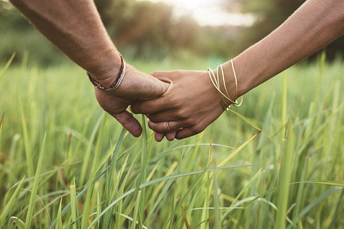 Young couple in love holding hands
